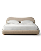 Avyelle Curved Upholstered Camel-Back Sandstone Bed