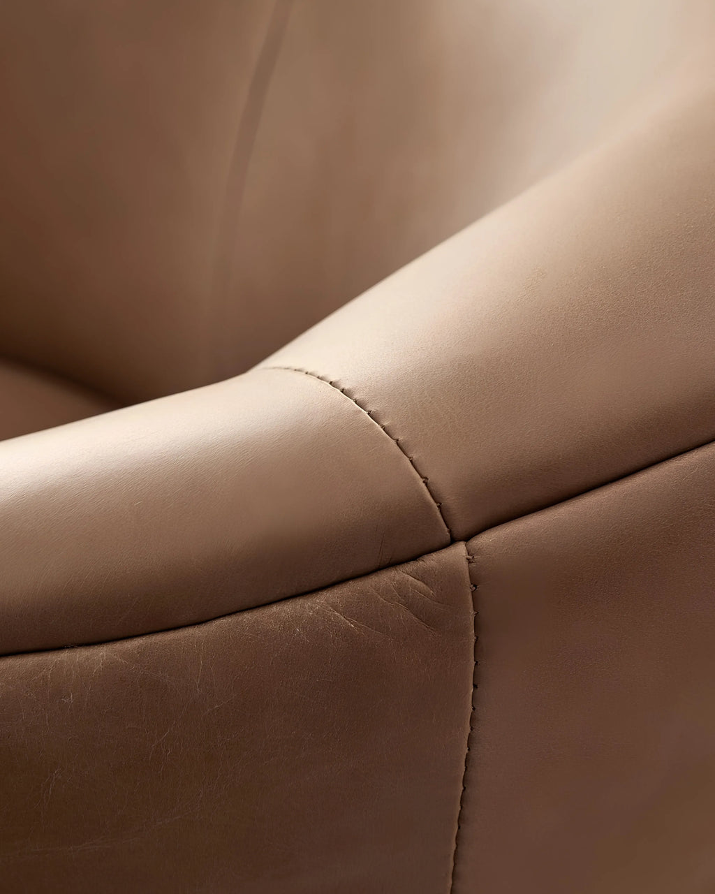 Velastra Top-Grain Leather Swivel Accent Chair