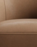 Velastra Top-Grain Leather Swivel Accent Chair